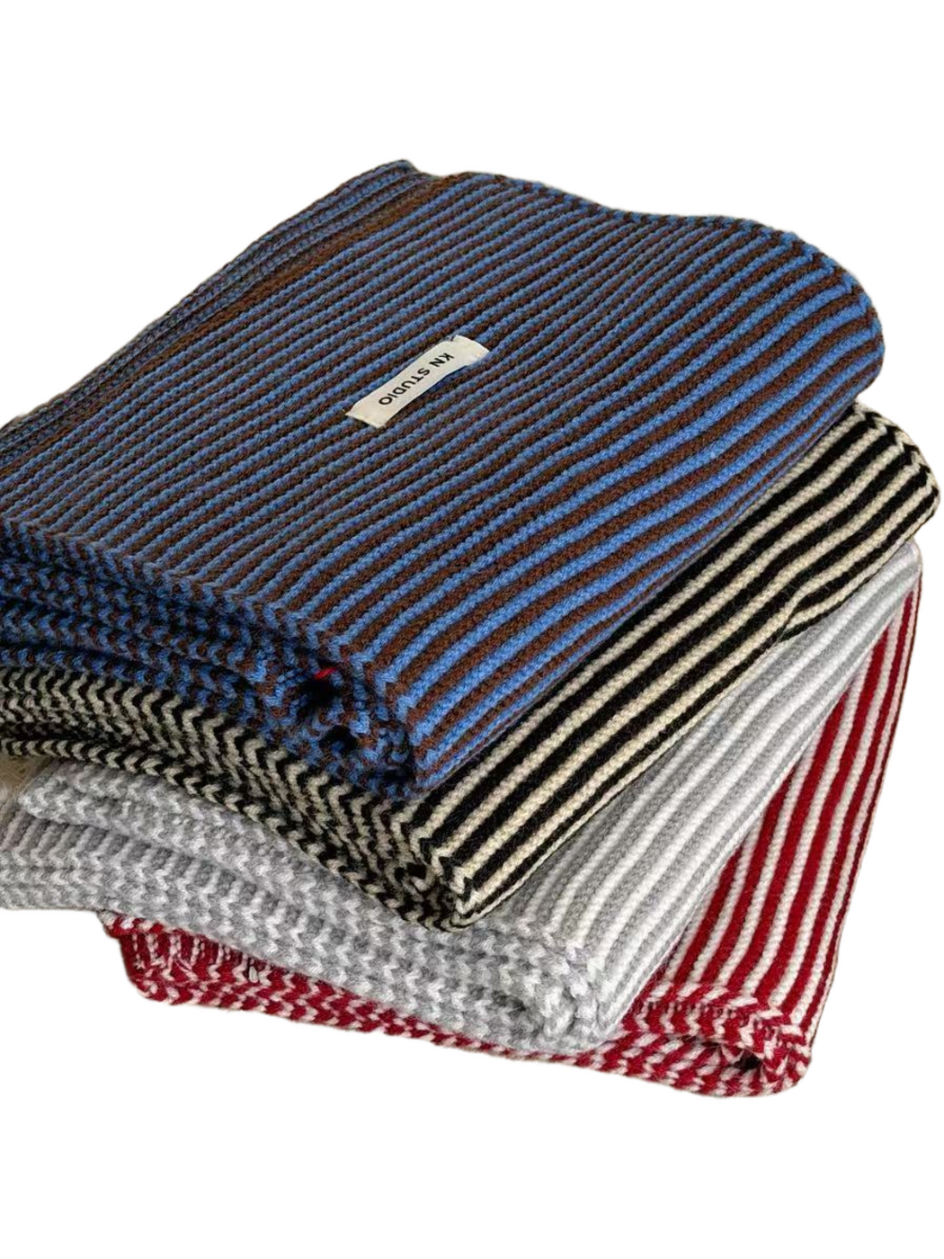 Stacked Blue, Black, Gray and Red striped scarves showing folded edges