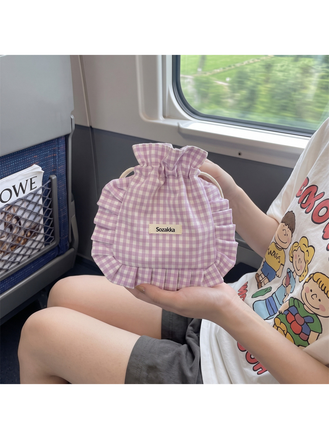 Light Purple gingham drawstring pouch held upright, showing its gathered opening