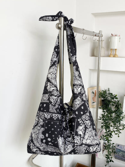Top view of Cosbai sling tote bag displaying open interior and lining