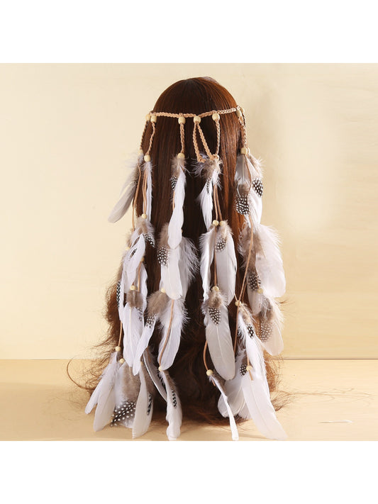 Close-up of Hairish feather and beaded hair headband showing detailed beadwork and feathers