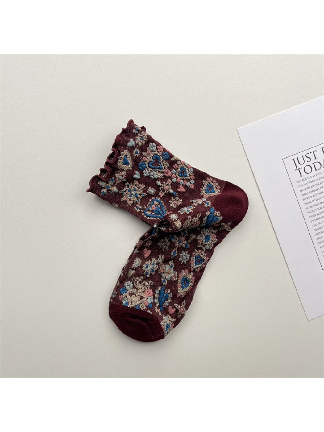 Pair of Rufia Heart White Mid-Calf Socks displayed side by side on white background