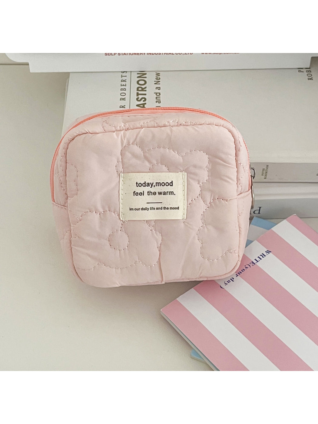 Close-up of the soft puffy texture and stitching details on Cosbai cosmetic bag