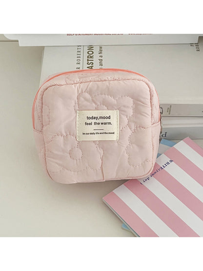 Close-up of the soft puffy texture and stitching details on Cosbai cosmetic bag