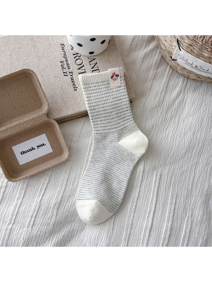 Rufia crew socks featuring dog embroidery and striped pattern displayed on white background