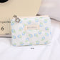 Cosbai floral coin purse displayed on a plain surface showing front floral pattern