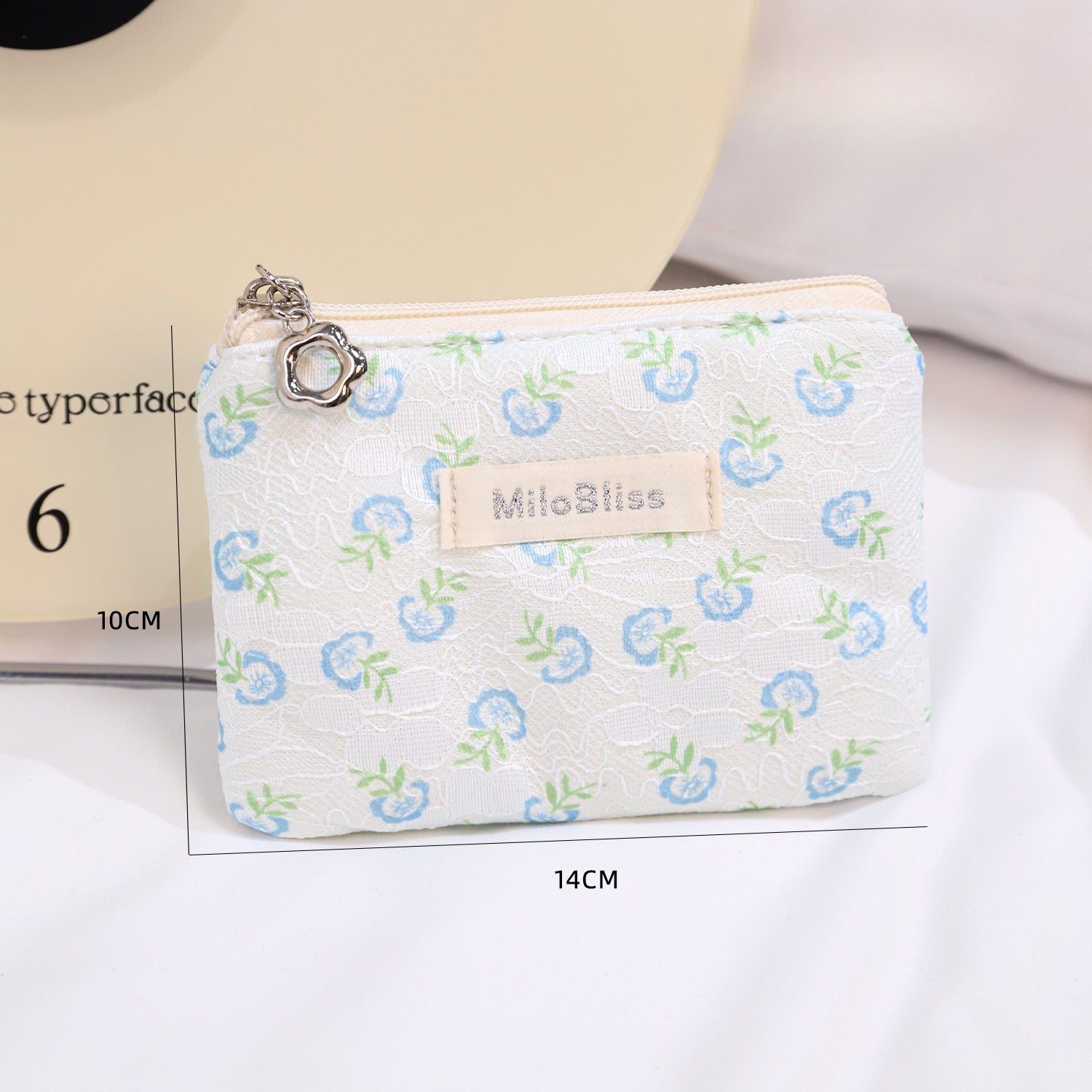 Cosbai floral coin purse displayed on a plain surface showing front floral pattern