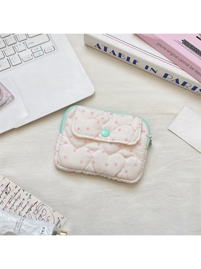 Close-up of the quilted heart pattern on the pink mini card pouch by Cosbai