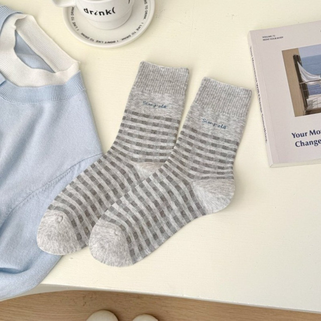 Stack of Rufia casual fine stripe crew socks in assorted colors