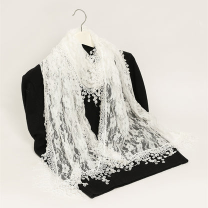 Sheer floral lace wrap scarf in soft beige displayed flat