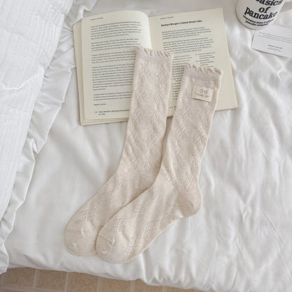 Rufia Fine Stripe Charm Crew Socks folded to show texture and stripe colors