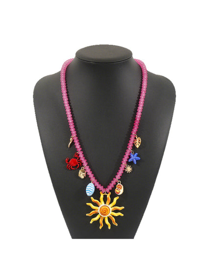 Color Charm beaded necklace displayed flat with beads in various bright colors