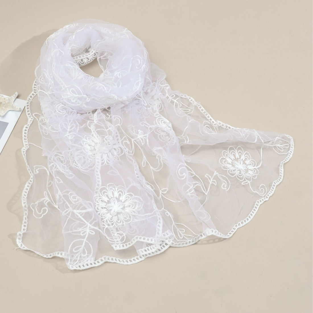 Scarvii lightweight sheer scarf folded to show floral mesh design