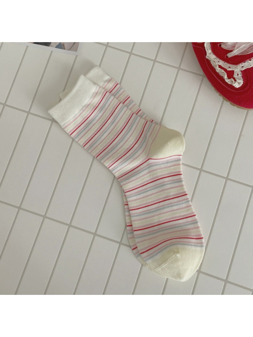 Rufia dog mid-calf socks shown from the side angle on a dog model