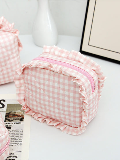 Cosbai checkered makeup pouch trio with ruffle trim shown from top view