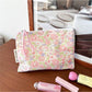 Cosbai floral cartoon cosmetic bag featuring a mix of floral and cartoon elements in bright colors
