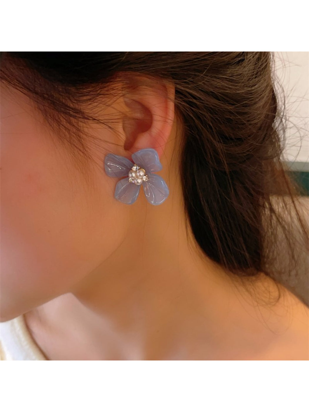 Earwish Rounded Petal Bloom Earrings photographed with soft shadows on a light background