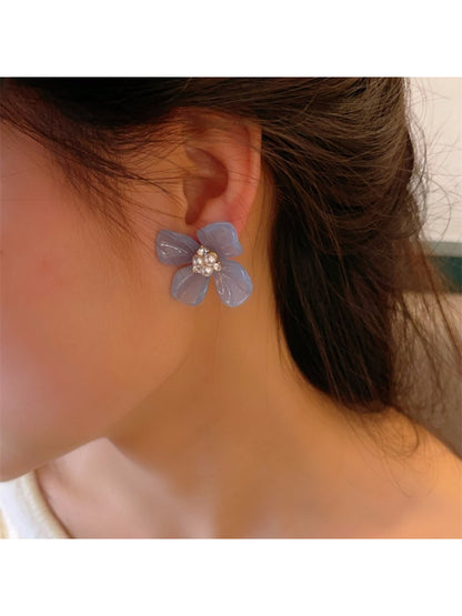 Earwish Rounded Petal Bloom Earrings photographed with soft shadows on a light background