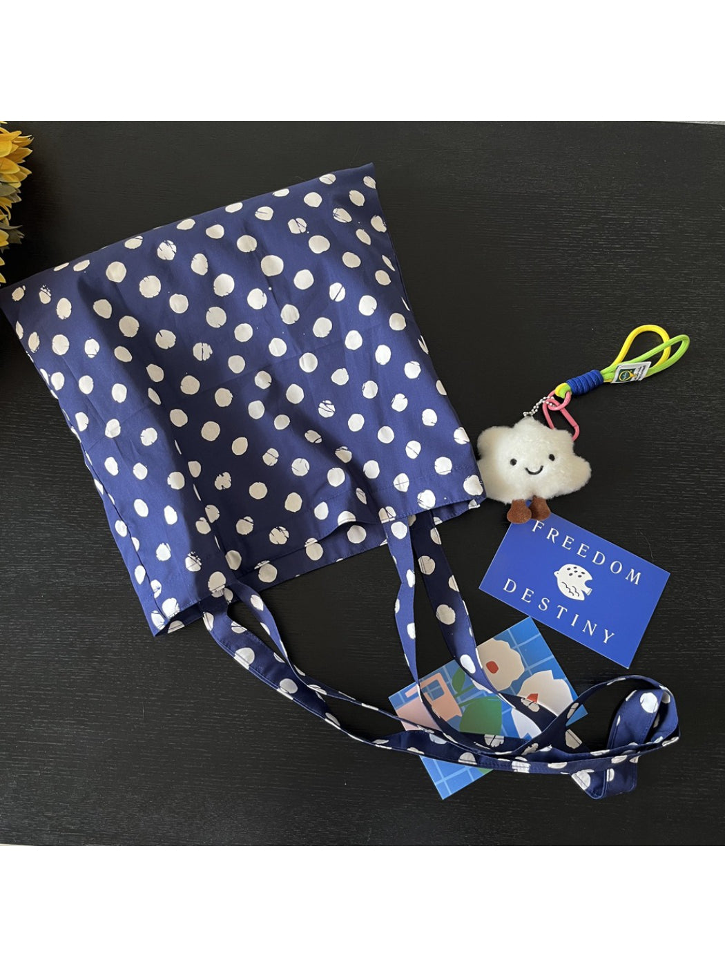 Top view of Cosbai navy polka dot tote bag showing open interior and tan trim