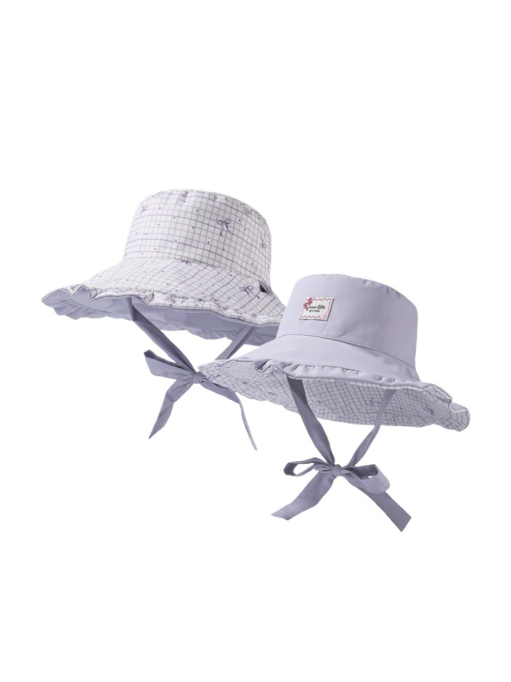 Model wearing Haila soft check bucket hat outdoors, styled with casual outfit