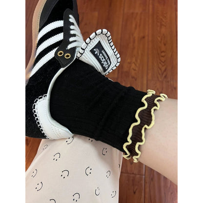 Rufia long socks paired with casual outfit, showing wave trim