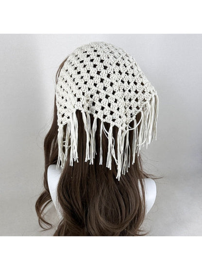 Boho tassel crochet bandana in cream color styled on a wooden surface