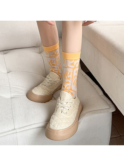 Rufia floral mixed crew socks folded neatly showing vibrant multicolor floral patterns