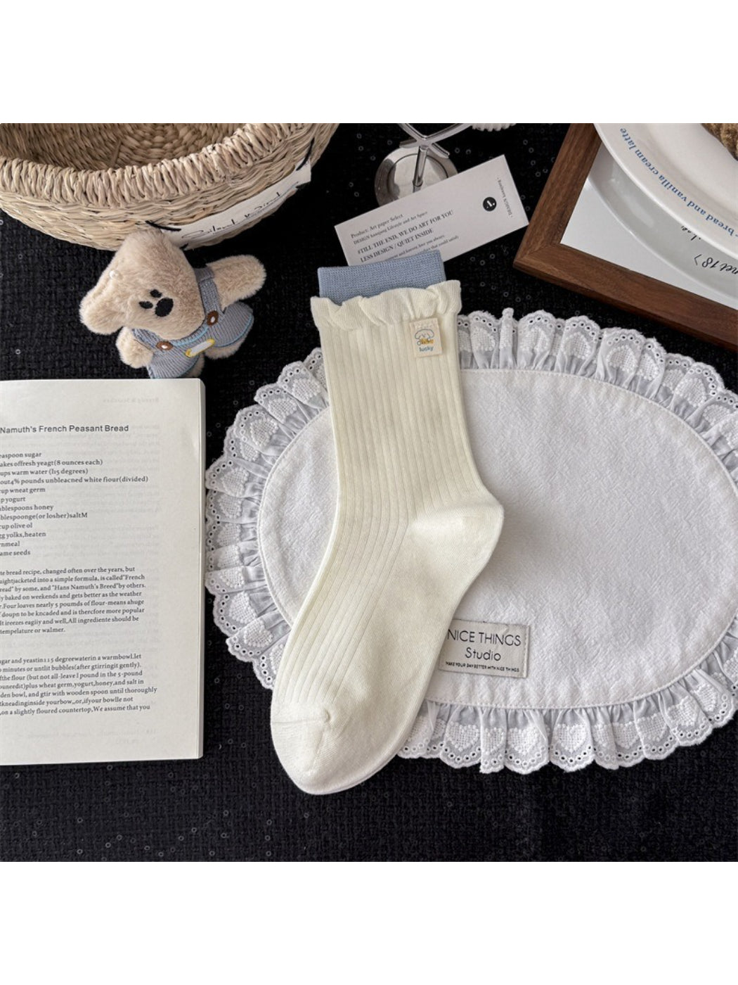 Rufia knit socks displayed with packaging showing brand label