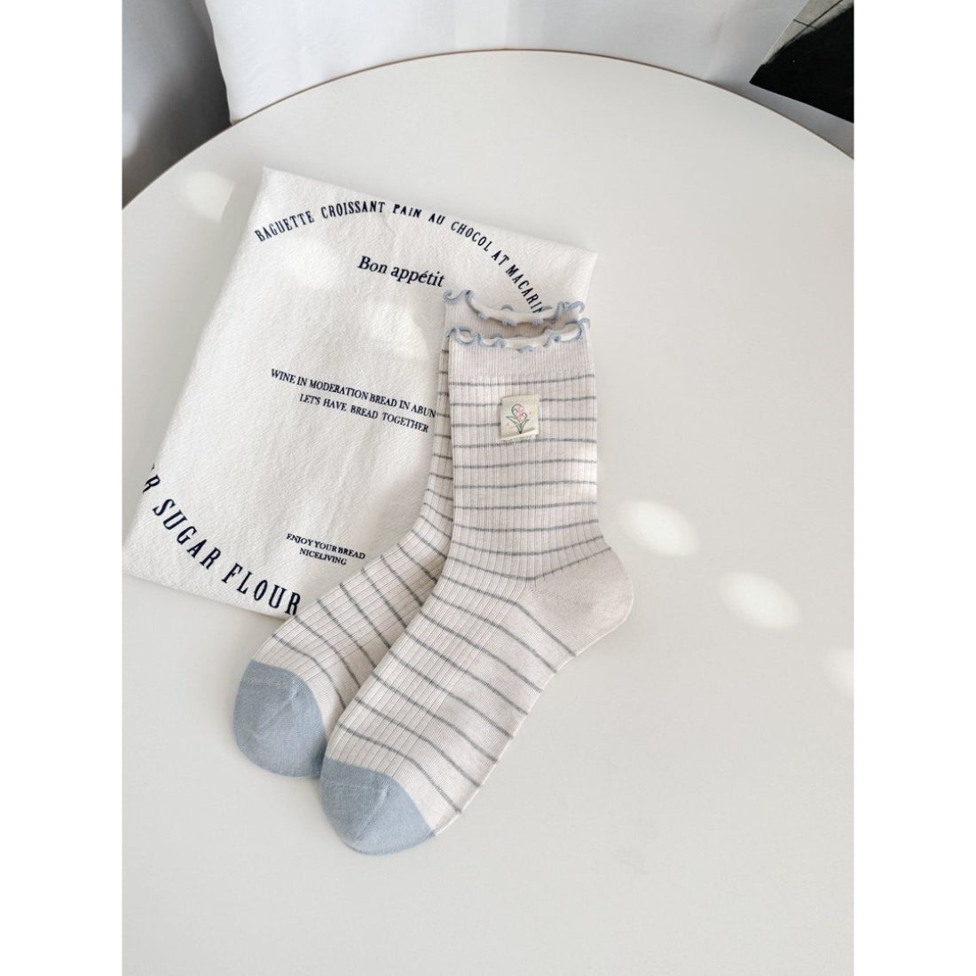 Rufia Lettuce Edge Stripe Crew Socks folded to show texture and fabric