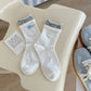 Rufia - Asymmetrical Button Detail Crew Socks