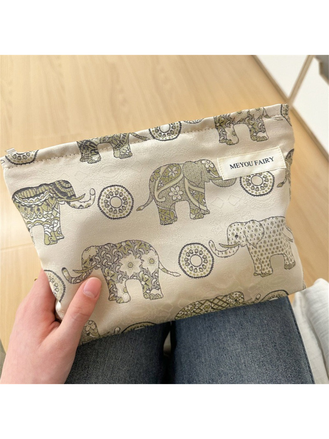 Cosbai Boho elephant pattern cosmetic bag displayed on wooden surface