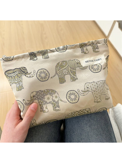 Cosbai Boho elephant pattern cosmetic bag displayed on wooden surface