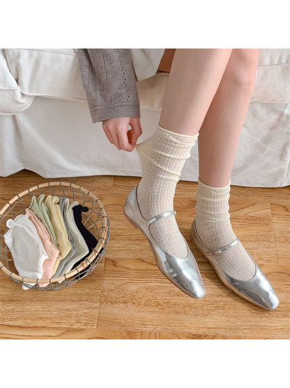 Pair of Rufia rolled edge textured crew socks in beige color laid flat