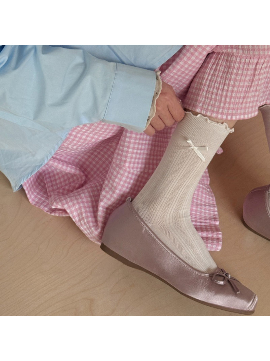 Close-up of Rufia crew socks showing soft fabric and frill trim around the cuff