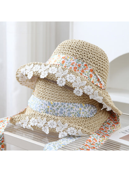 Haila bucket hat with lace trim and floral band displayed on a white background