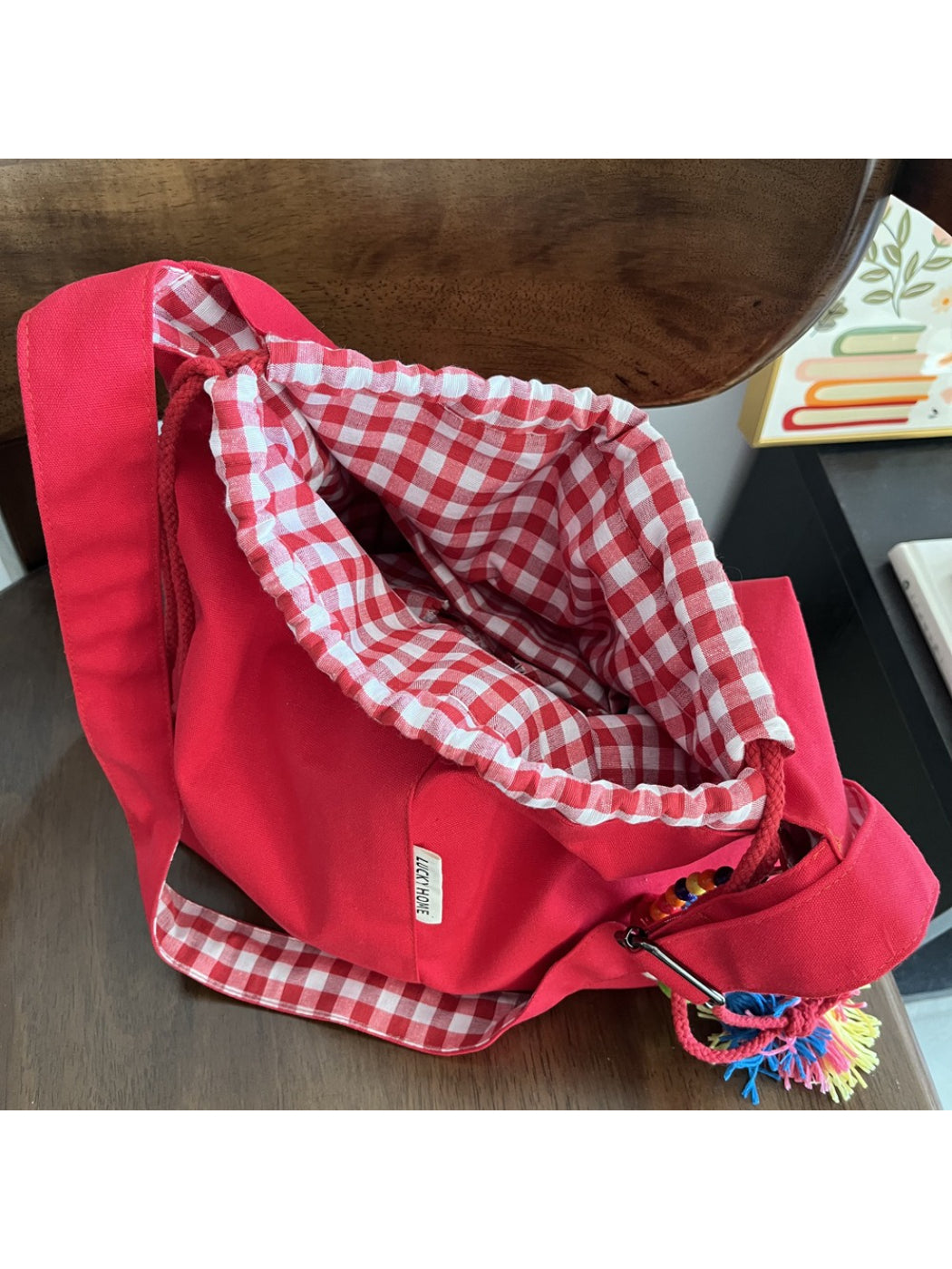 Cosbai gingham trim tassel bucket bag styled with casual outfit