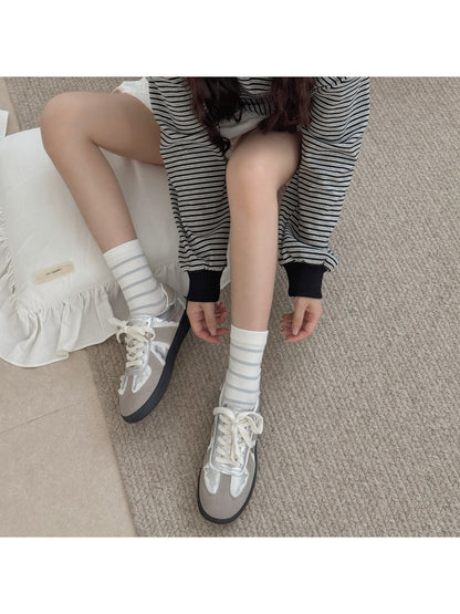Rufia crew socks displayed flat showing ruffle edges and knit texture