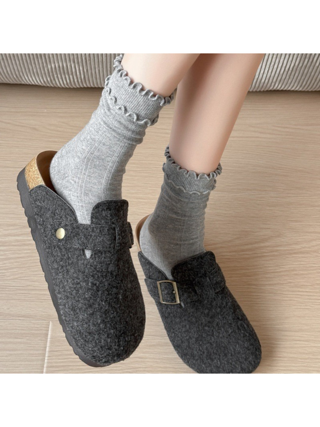 Pair of Rufia ruffle mid-calf socks in light brown laid side by side