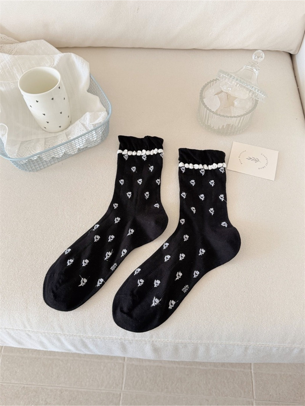 Side view of Rufia floral frill crew socks highlighting soft fabric texture