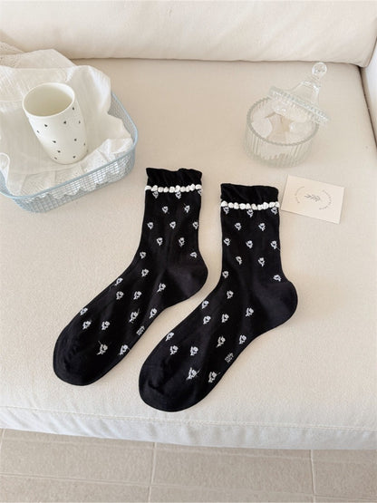 Side view of Rufia floral frill crew socks highlighting soft fabric texture