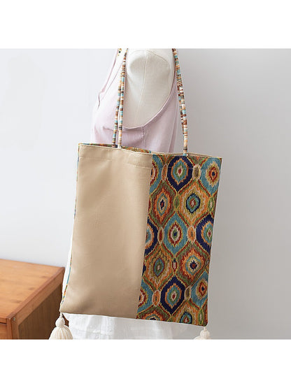 Cosbai Boho Ethnic Tassel Tote hanging with visible ethnic pattern and tassels