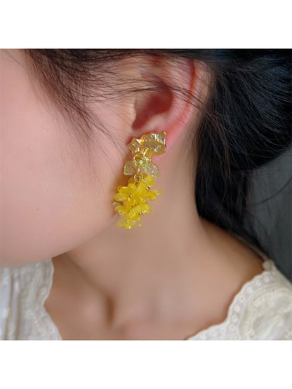 Earwish Floral Charm Layered Dangle Earrings worn by a model with a neutral background