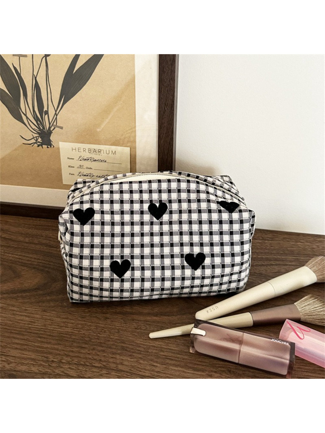 Close-up of black and white heart design on Cosbai makeup bag fabric