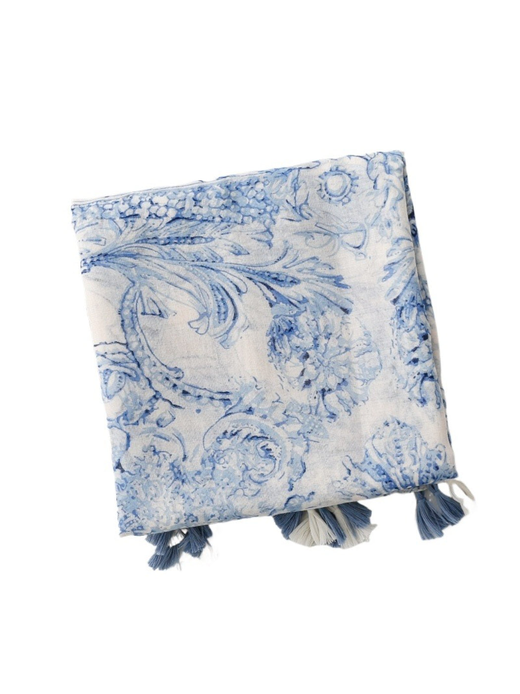 Close-up of blue baroque design and tassel detail on scarf
