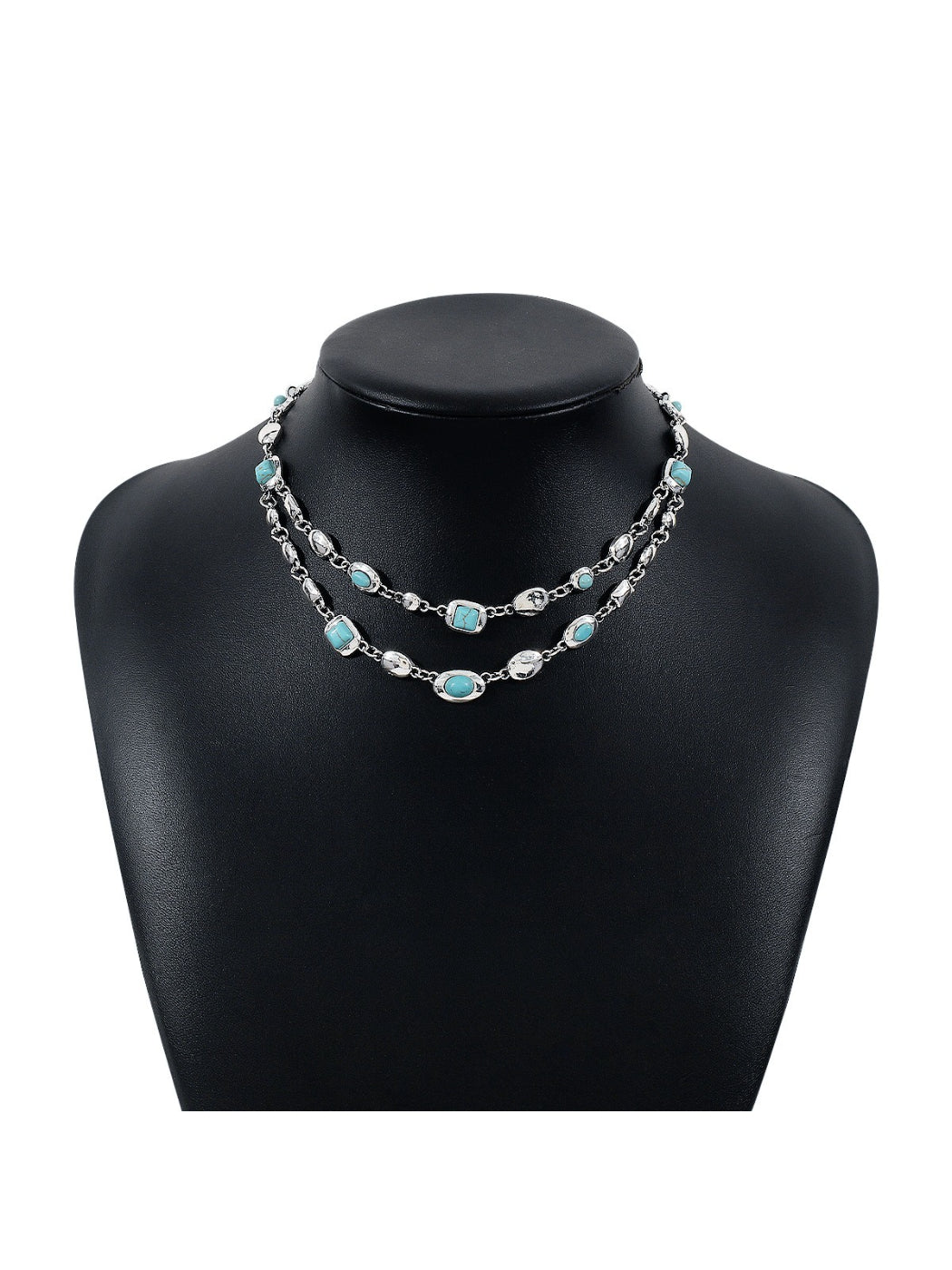 Side view of Neckit layered gem chain necklace highlighting the clasp and chain layers