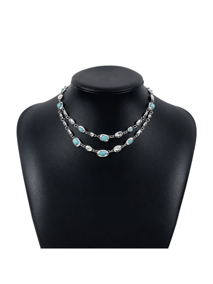 Side view of Neckit layered gem chain necklace highlighting the clasp and chain layers