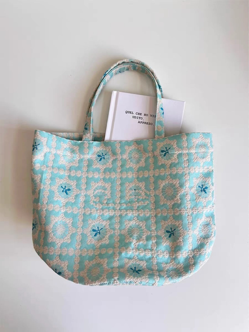 Side view of Cosbai Aqua Tapestry Bucket Tote Bag showing bucket shape and handles