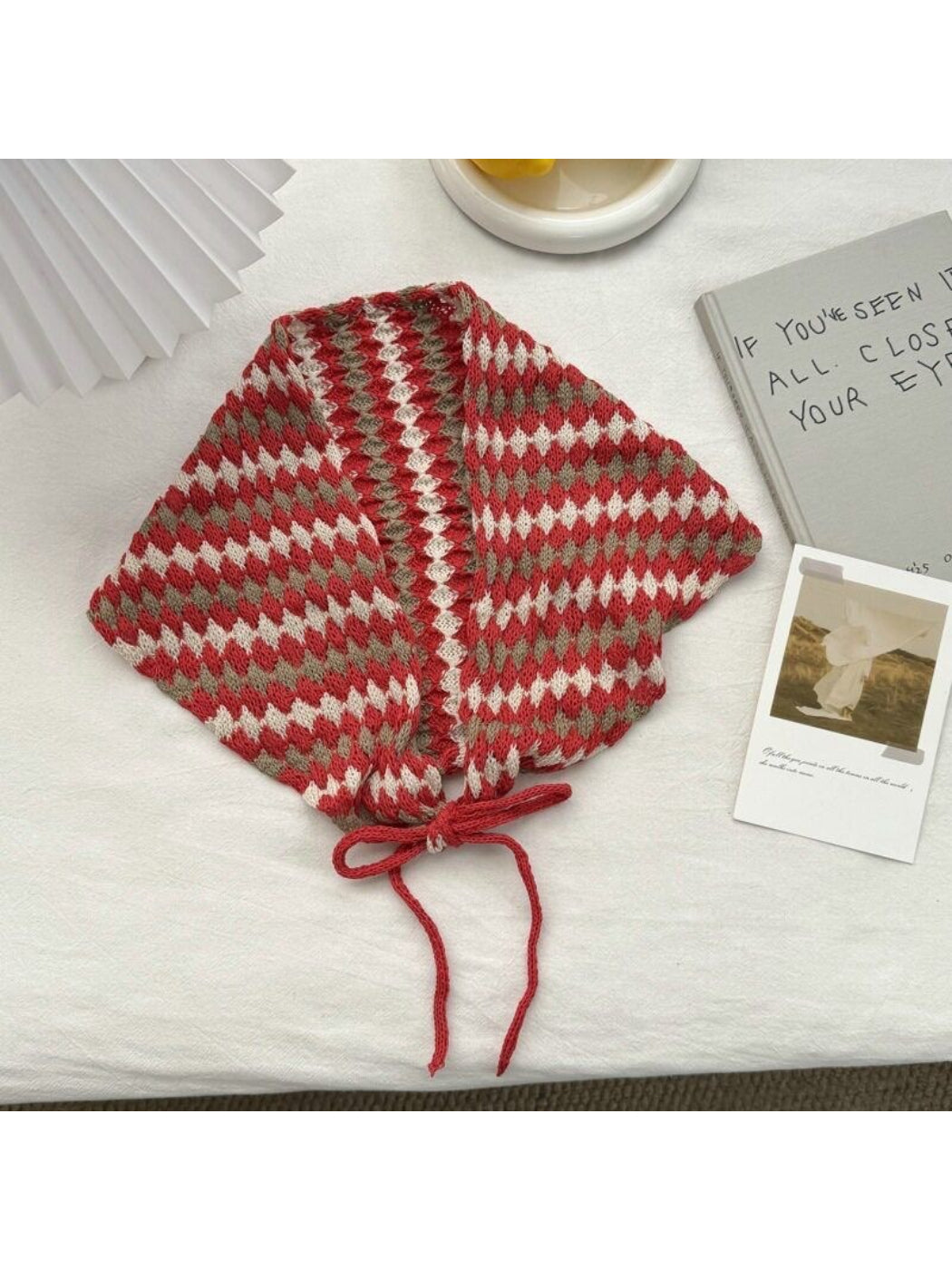 Detail of scarf edges showing knit texture and diamond pattern