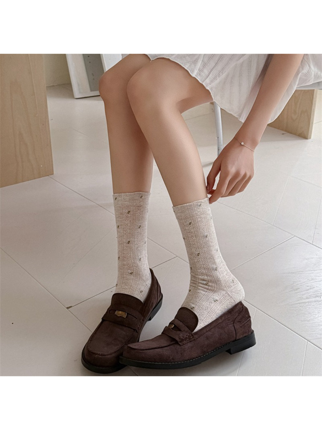 Side view of Rufia ditsy floral crew socks highlighting ribbed cuff
