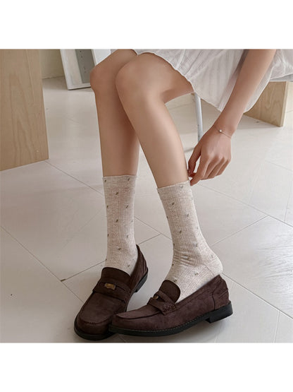 Side view of Rufia ditsy floral crew socks highlighting ribbed cuff
