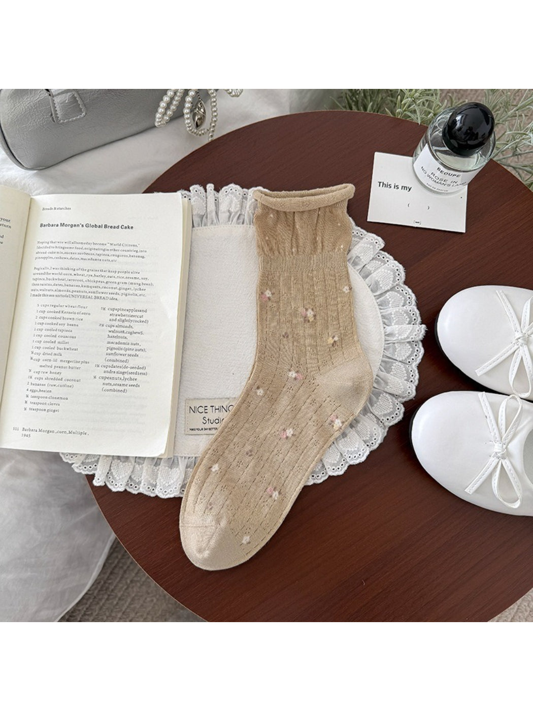 Rolled cuff floral socks shown from side angle highlighting cuff detail